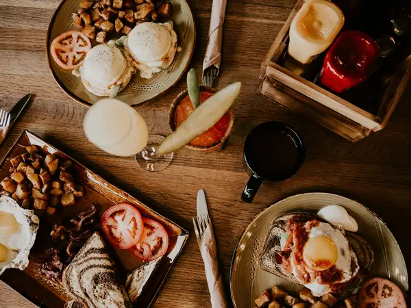 Brunch items like avocado toast, eggs benedict and eggs and bacon.